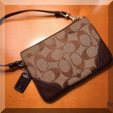 H03. Coach wristlet. 